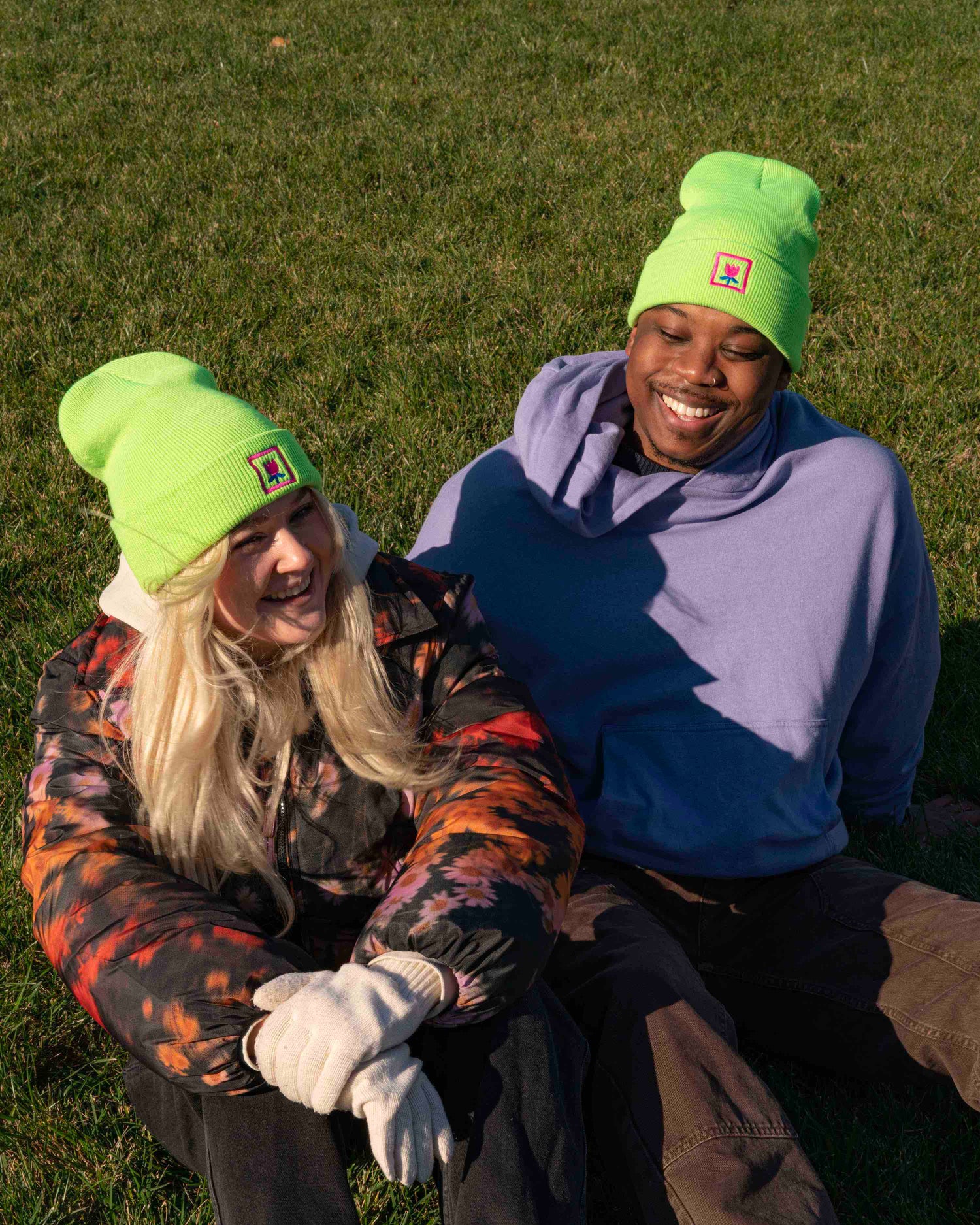 Girl and guy wearing lime green embroidered with pink rose